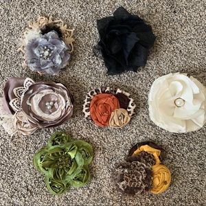Flower hair clip accessories. Or shirt/belt pins.